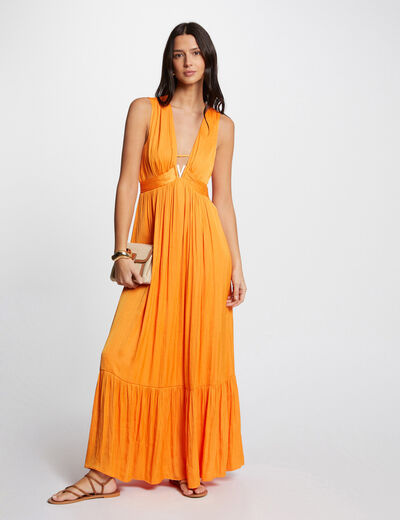 Lange soepelvallende jurk oranje vrouw
